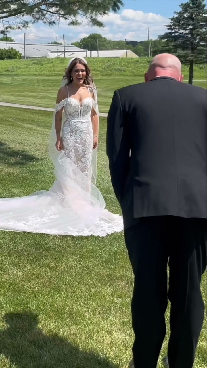 Bride and groom joyful first look reaction outdoors