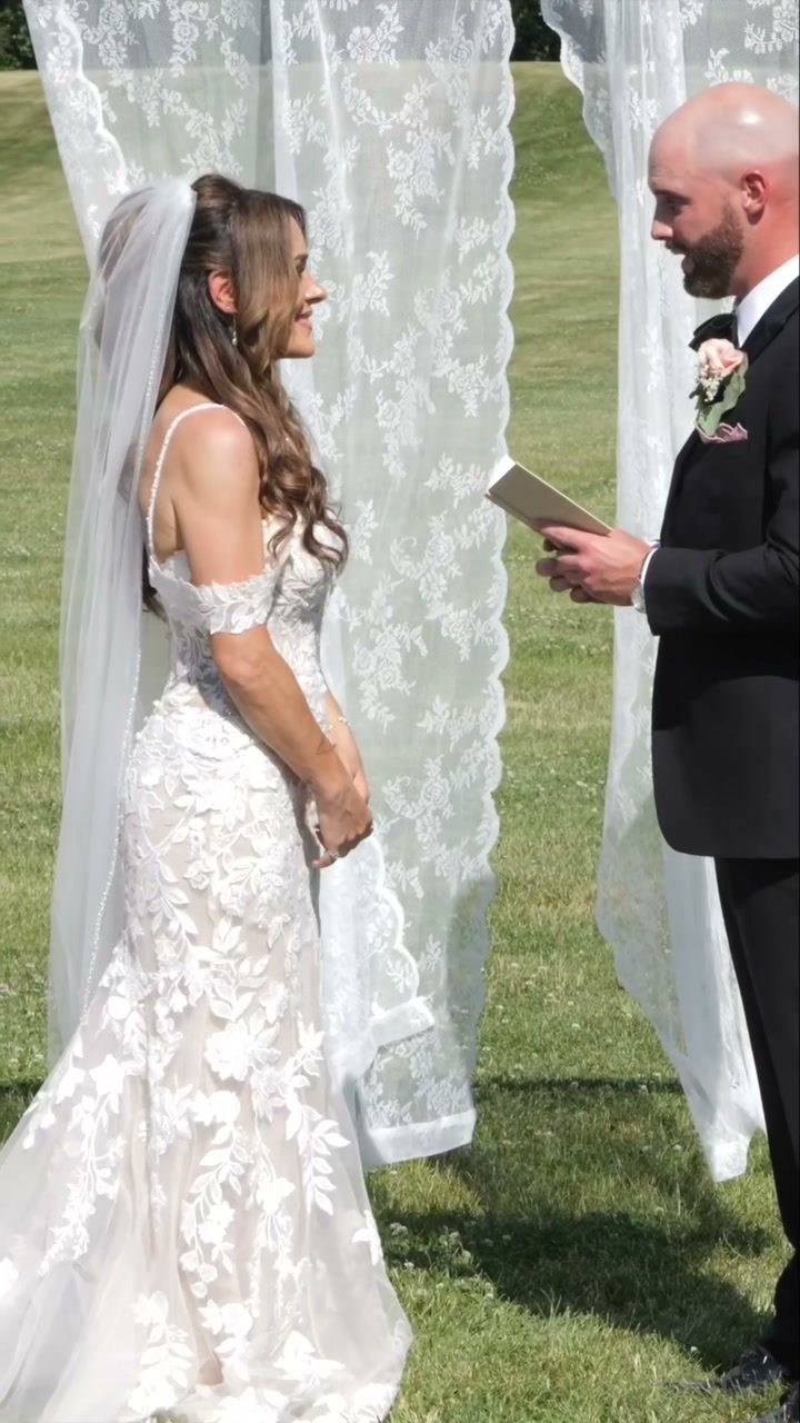 Lace draped arch ceremony vows exchange