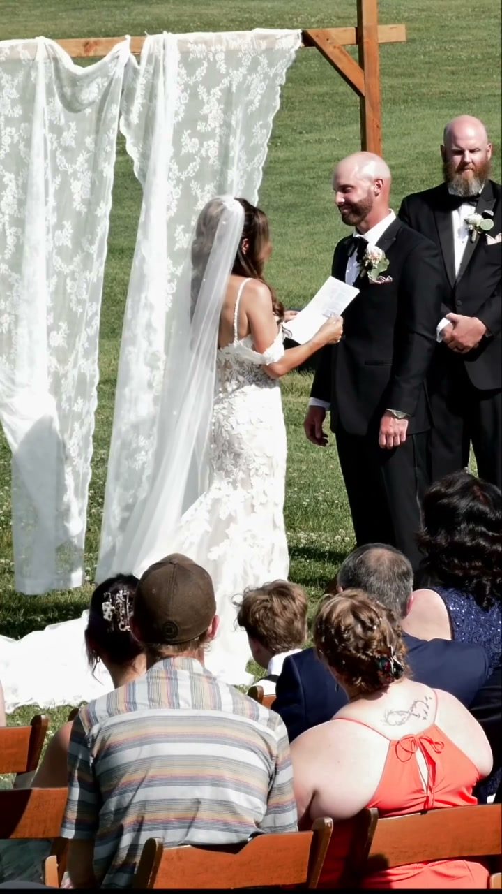 Heartfelt laughter during ceremony vows at the altar