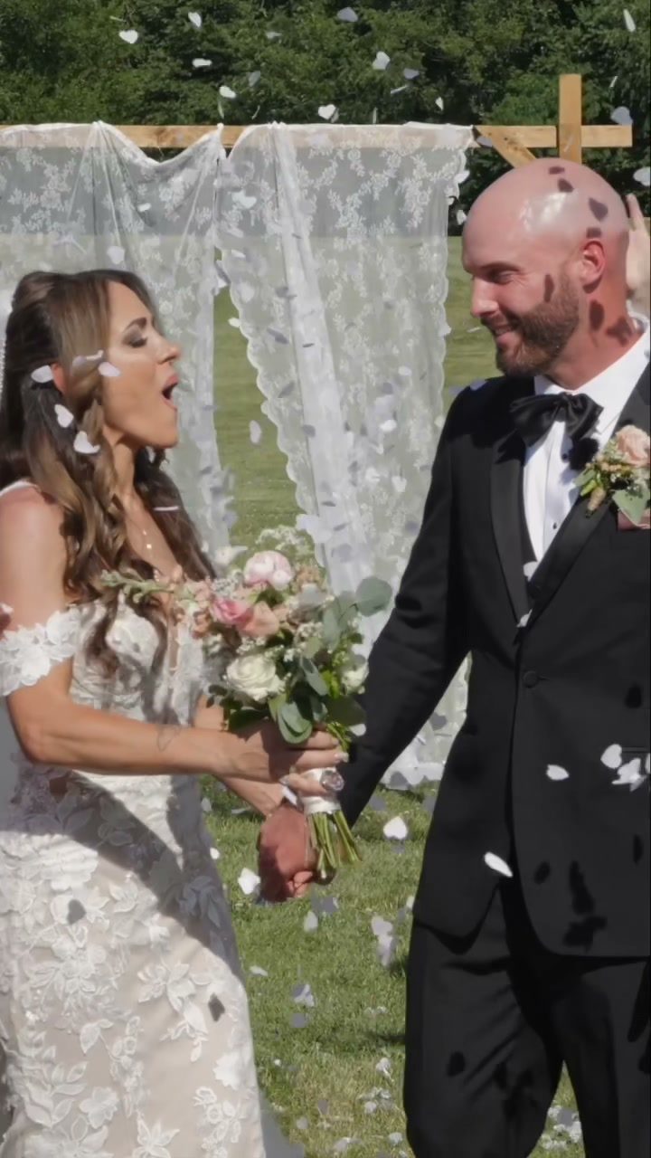 Newlyweds recessional petal toss celebration