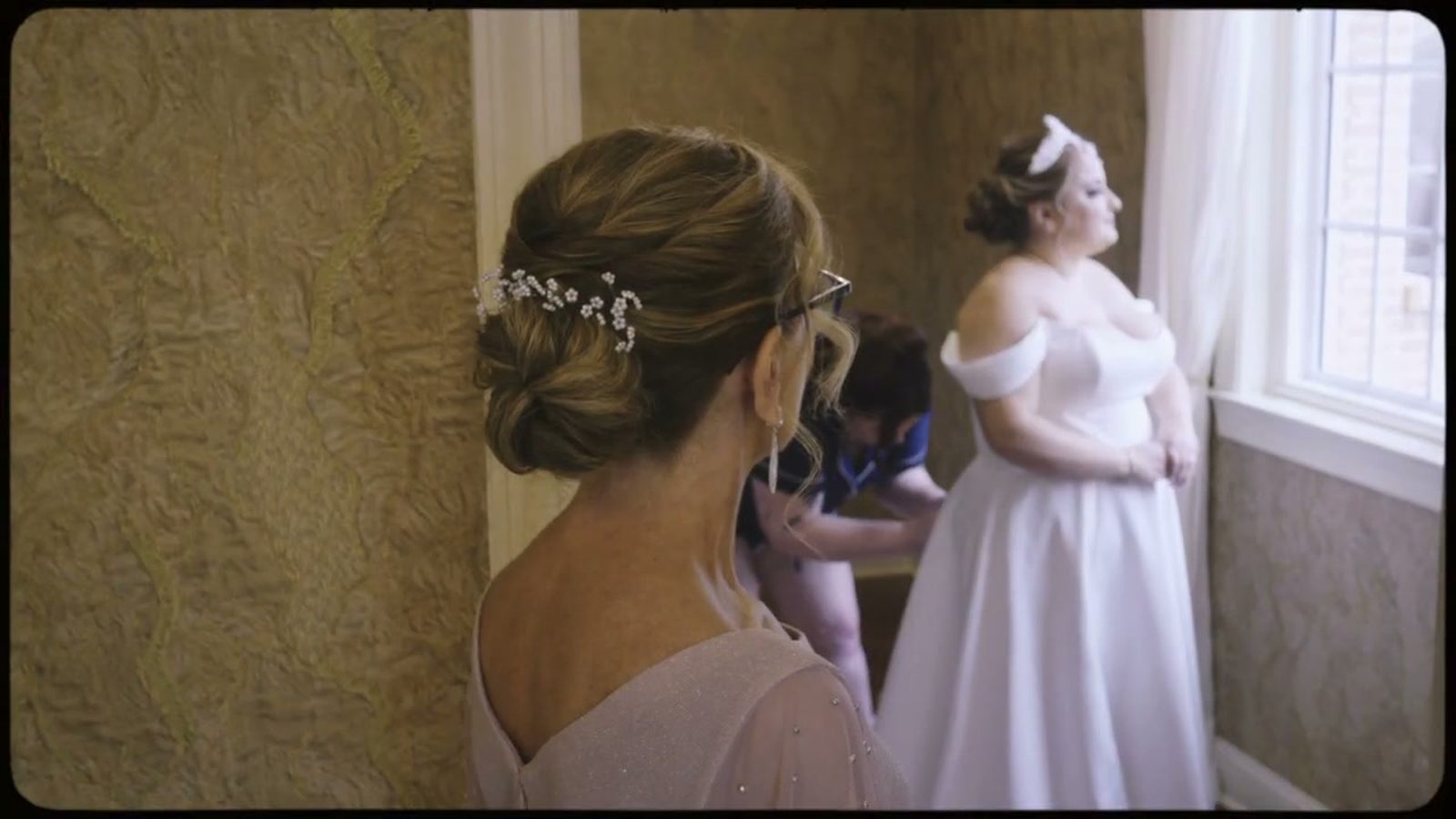 Bride gown preparation window silhouette at Bucks County wedding