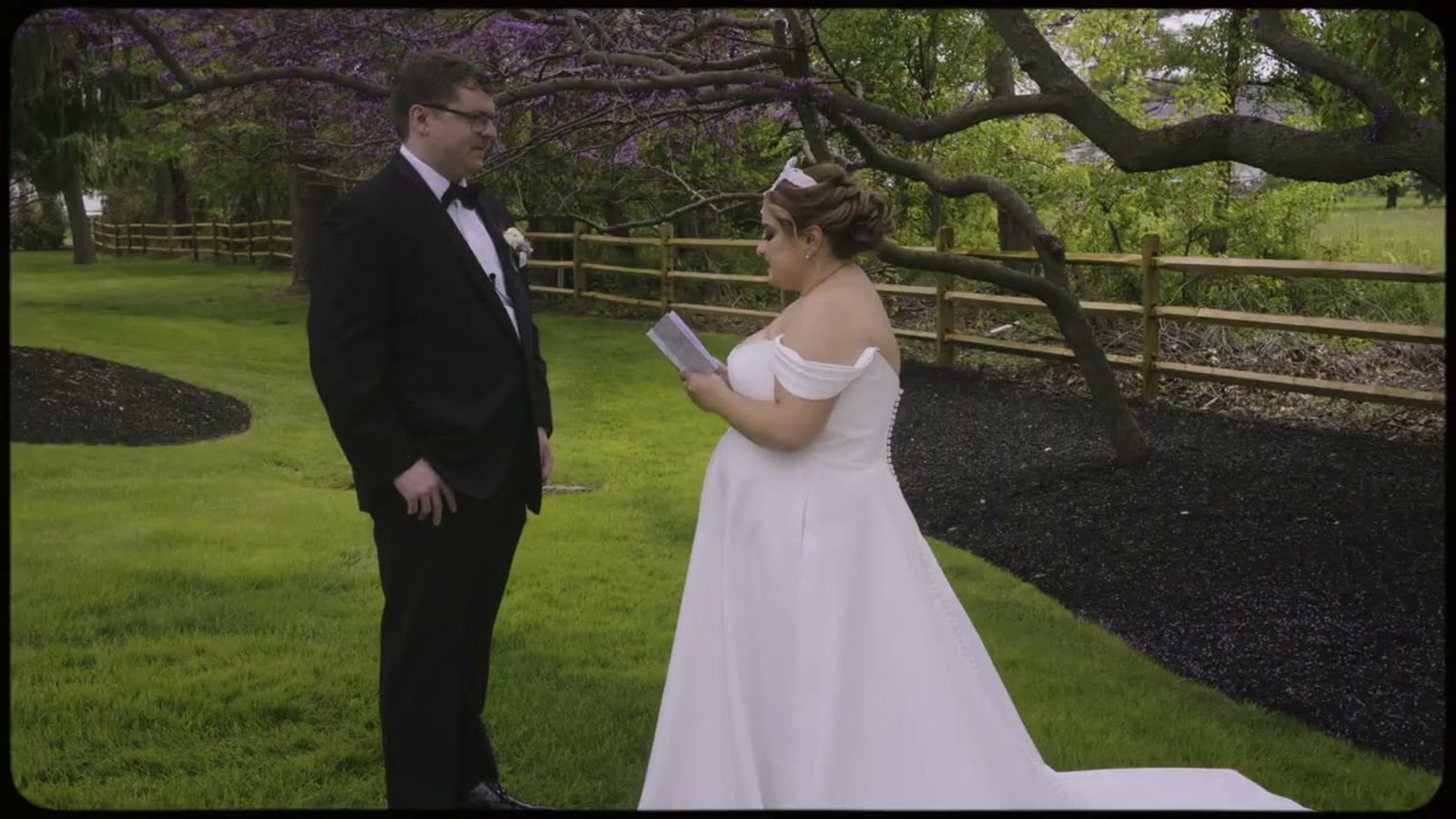 Private vow reading under blooming spring trees