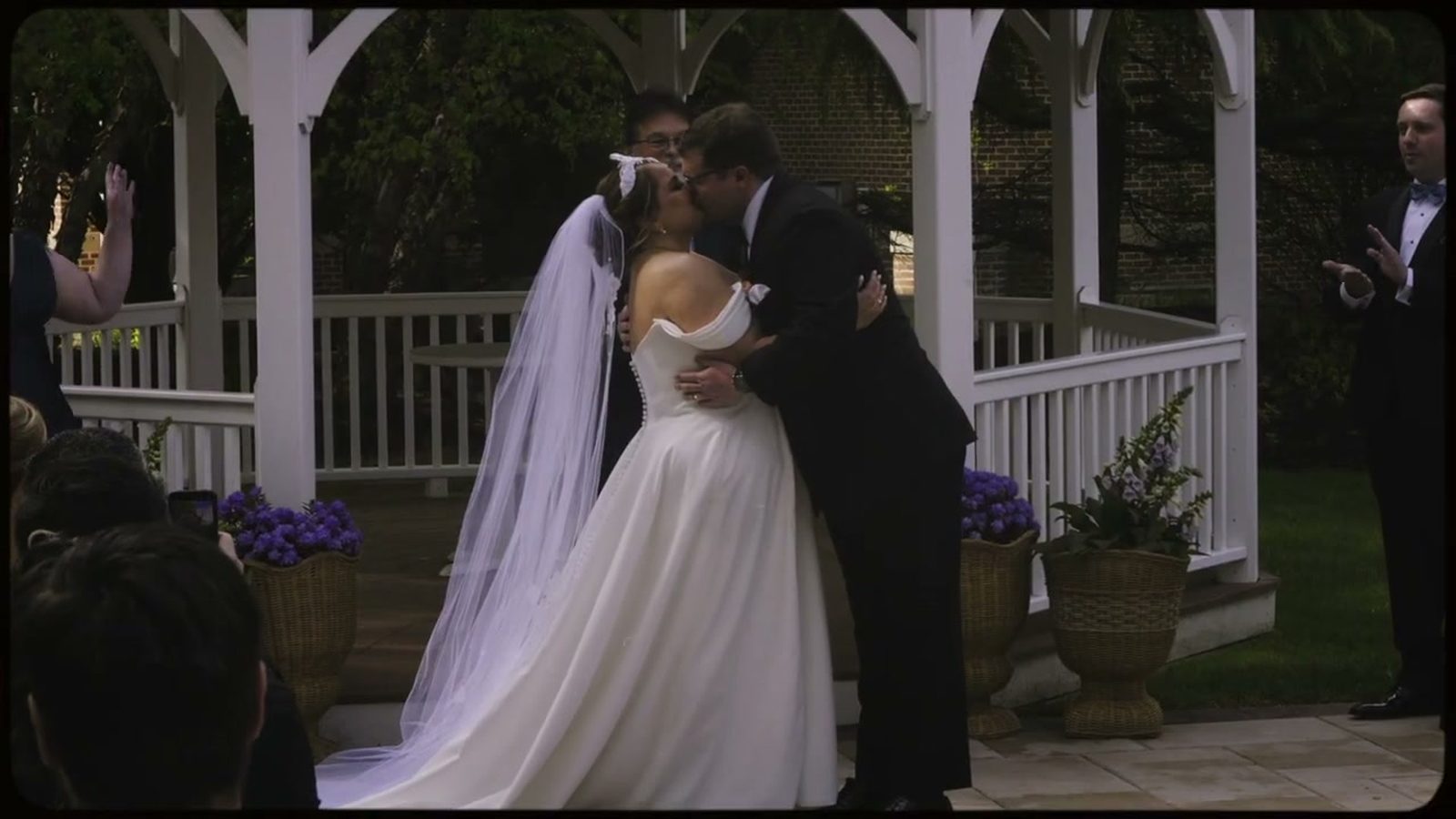 First kiss ceremony moment captured by Bucks County wedding videographer Elm AV