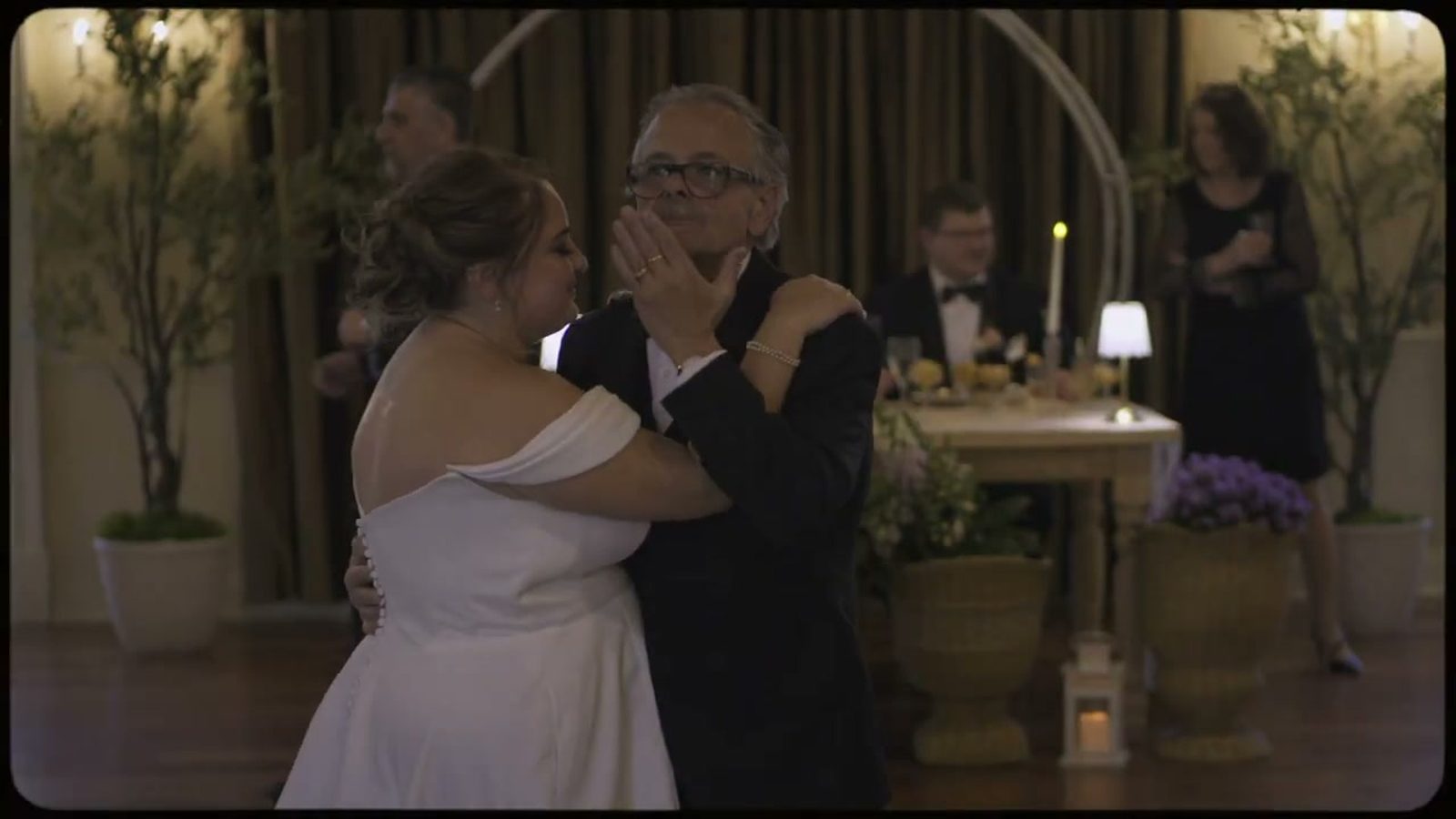 Emotional father daughter parent dance at wedding reception